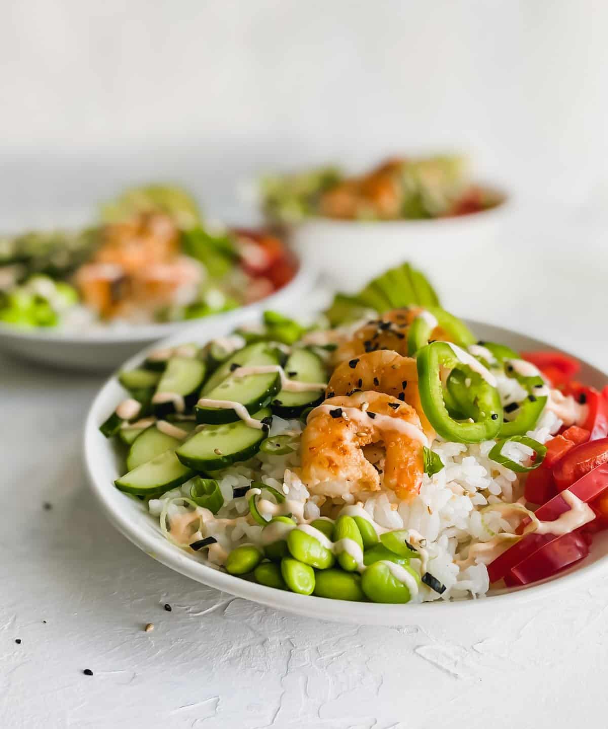 3 shrimp poke bowls in white bowls