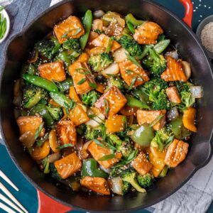 Teriyaki salmon stir fry in a large skillet.