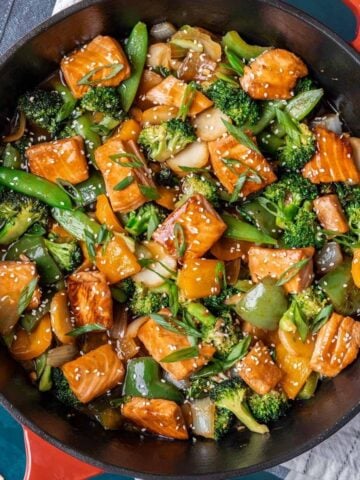 Teriyaki salmon stir fry in a large skillet.