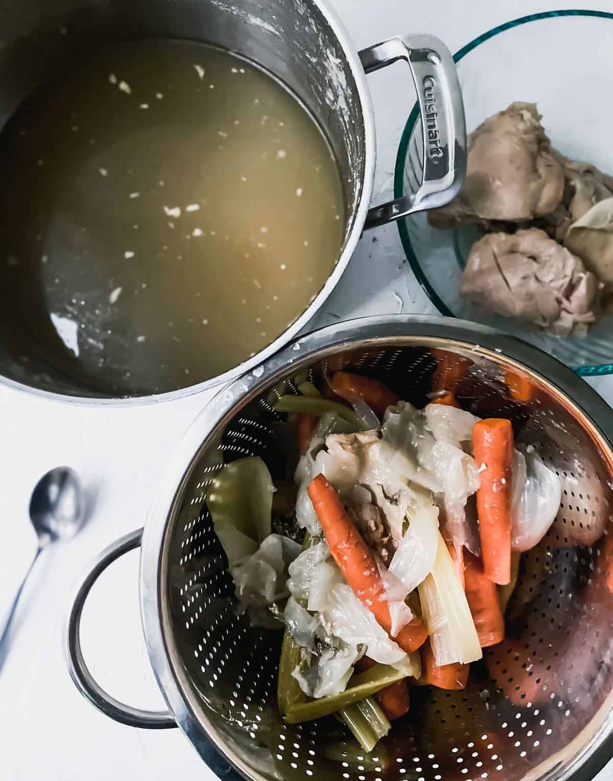 chicken thighs in a separate bowl with vegetables draining in a colander