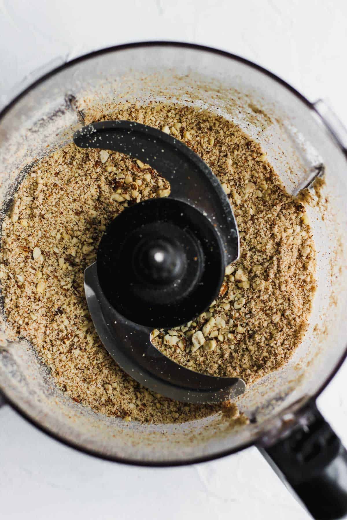 Blended raw almonds, breadcrumbs, and salt and pepper in a food processor.