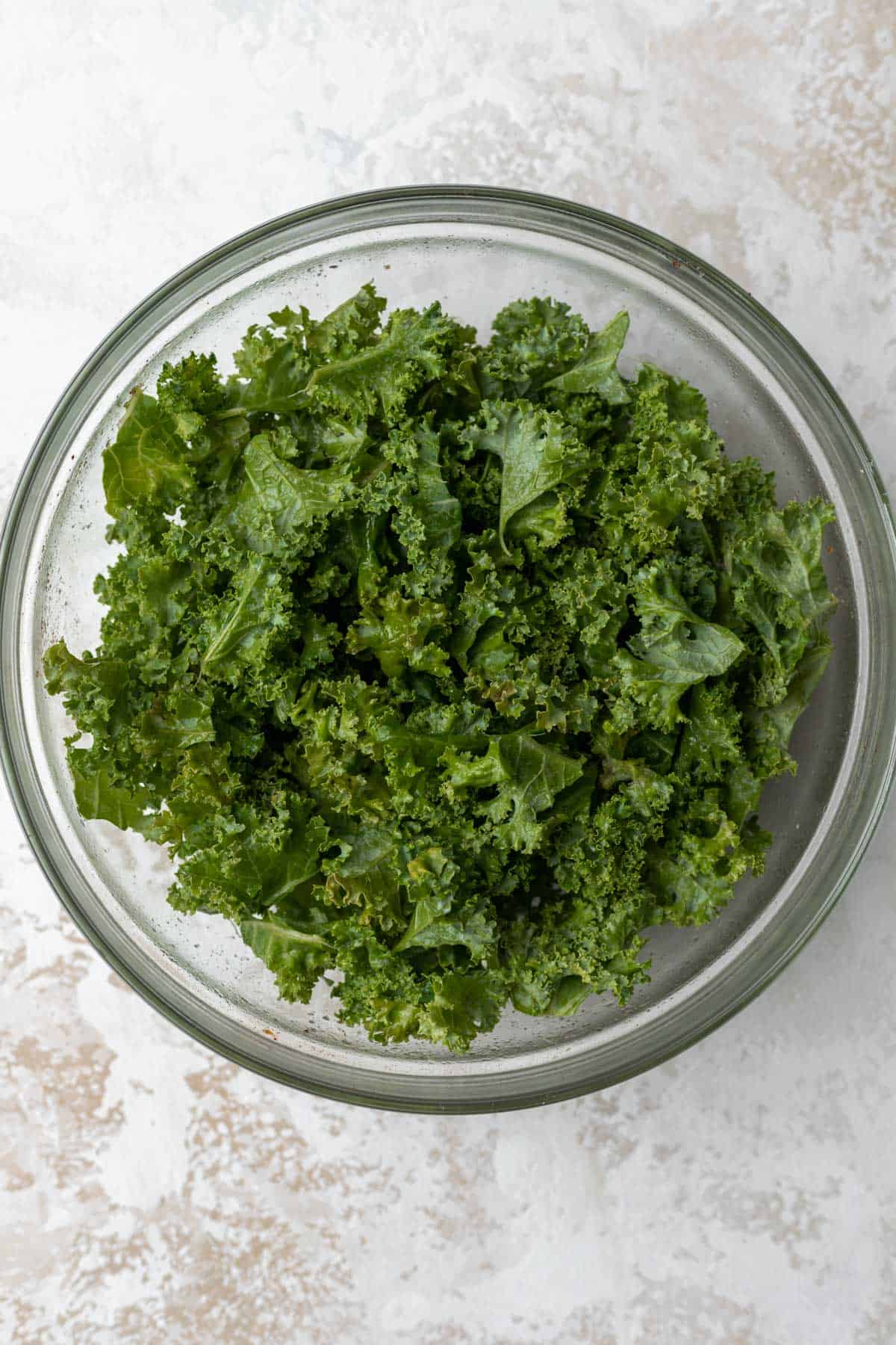 Chopped kale in a glass bowl.