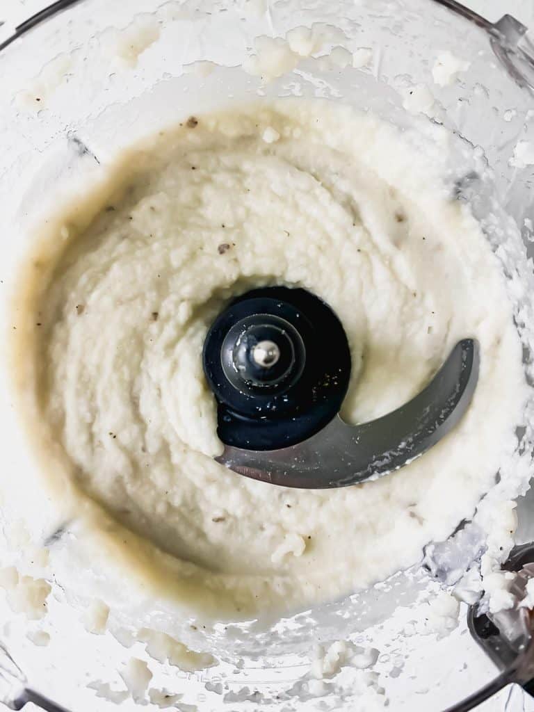 Blended garlic cauliflower mashed potatoes in a food processor.