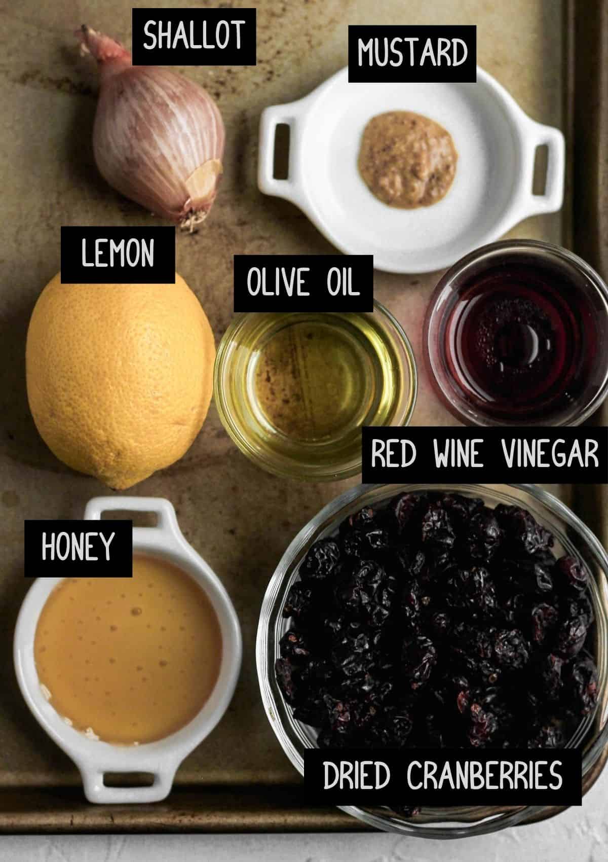 Labelled ingredients for the warm cranberry vinaigrette (see recipe for details).