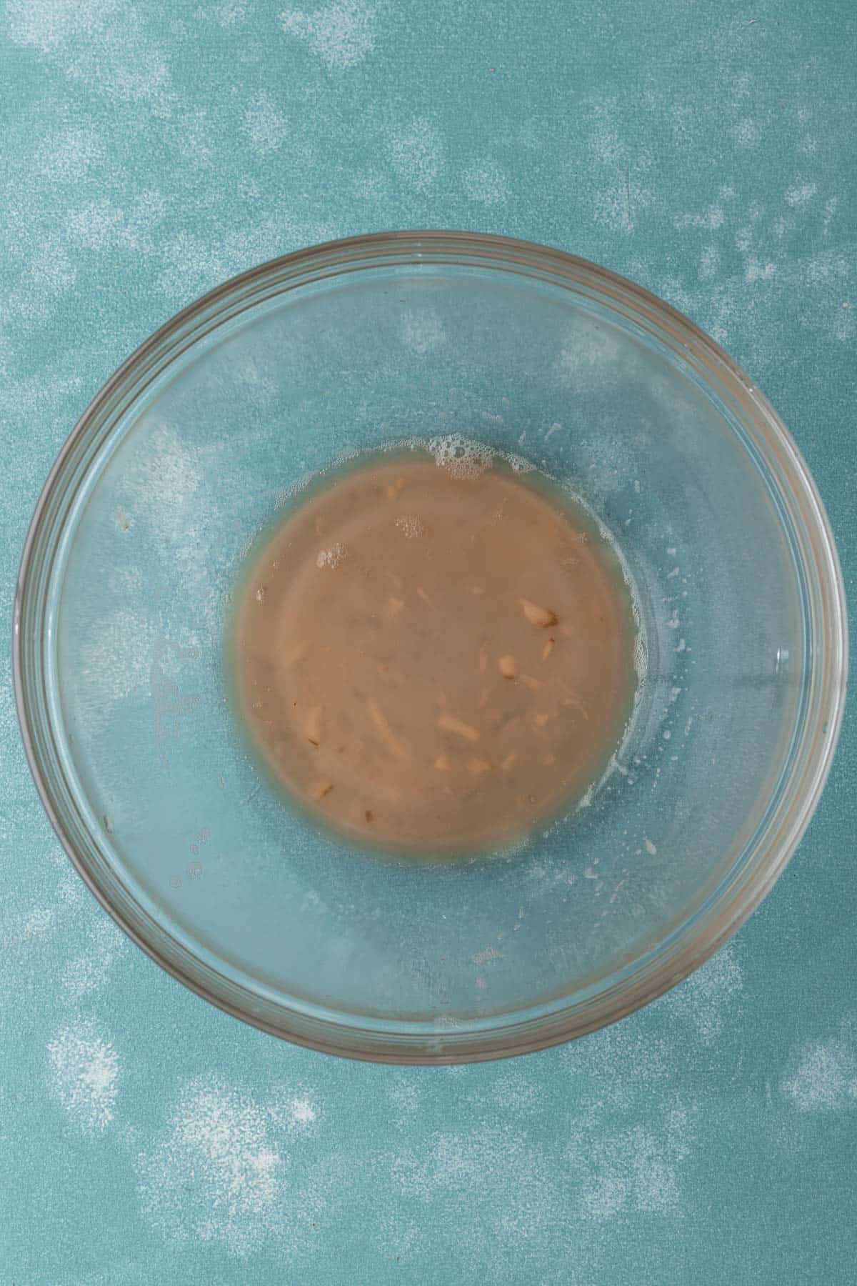 Remaining potato starch in a large glass mixing bowl.