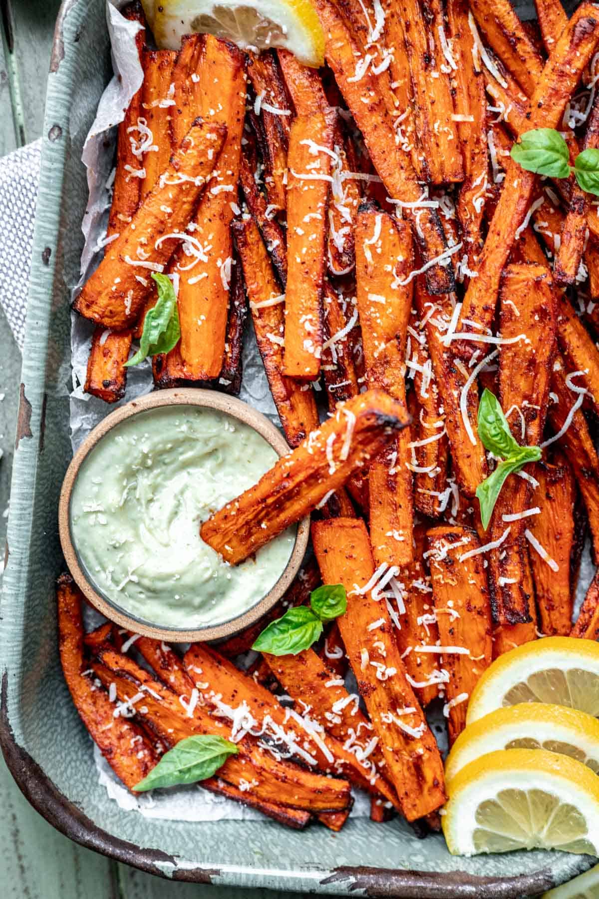 A carrot fry dipping into the pesto aioli.