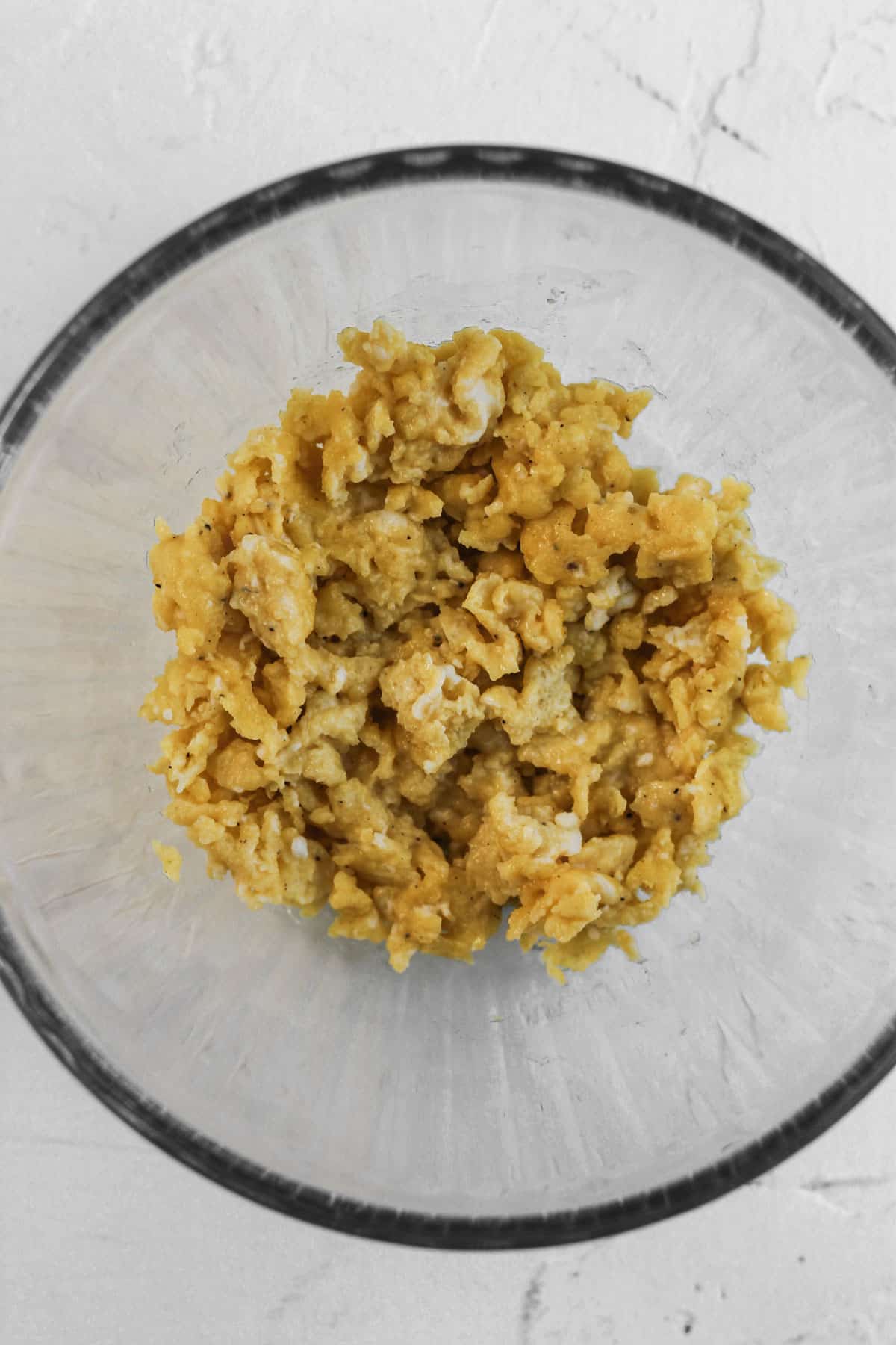 Cooked egg in a glass bowl.