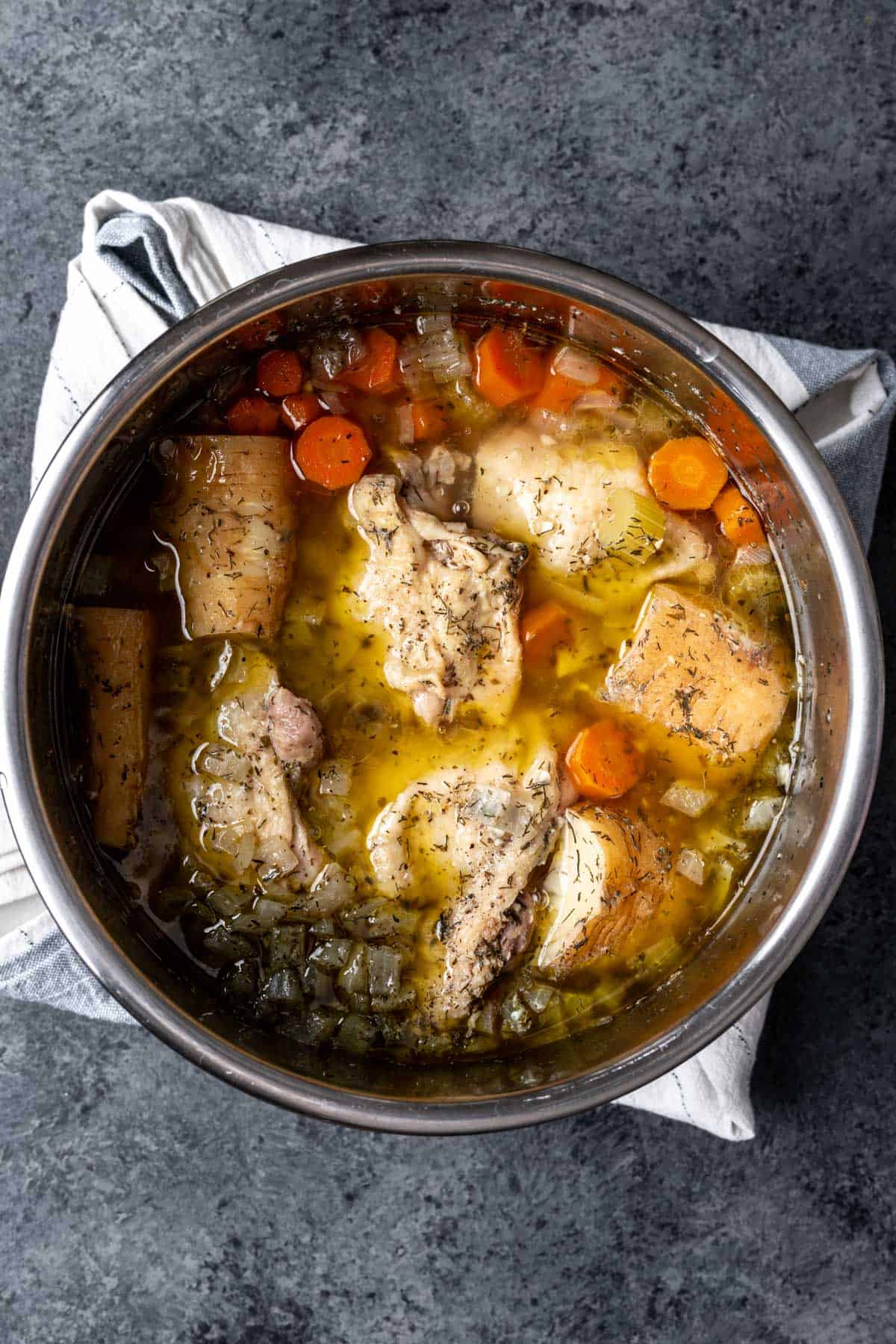 Cooked chicken after pressure cooking in the broth in the instant pot.