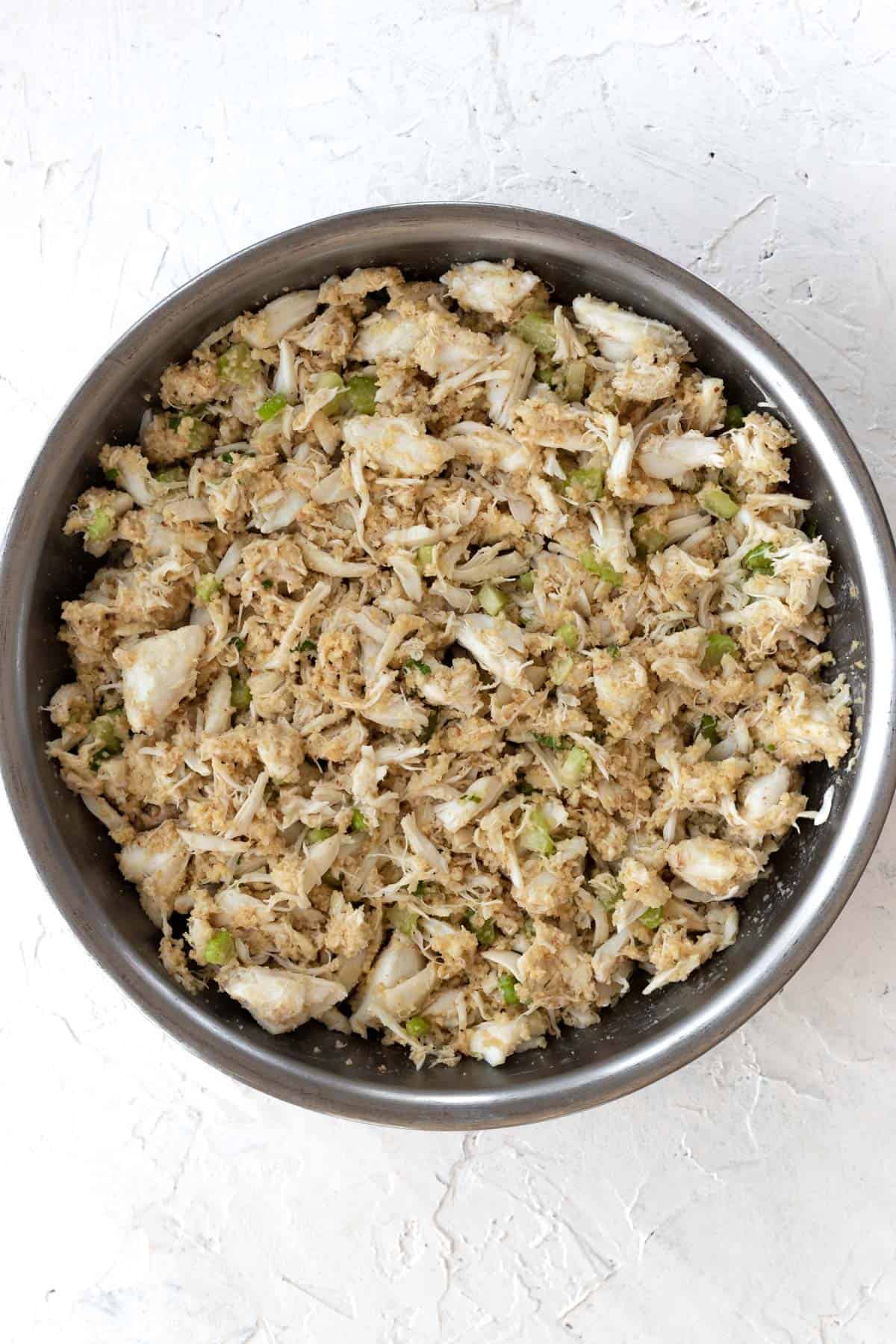 Crab, celery, and breadcrumbs mixed together with the egg and mayonnaise mixture.