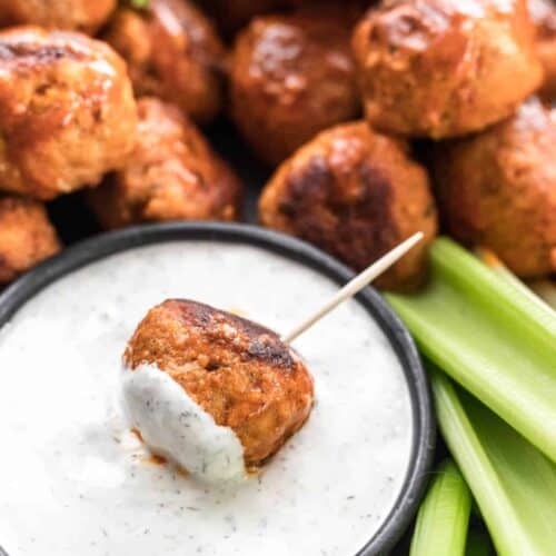 A buffalo turkey meatball on a toothpick dipped in feta ranch.