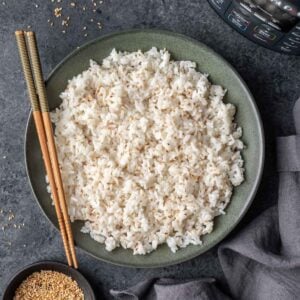 Instant pot sushi rice in a serving bowl with chopsticks.