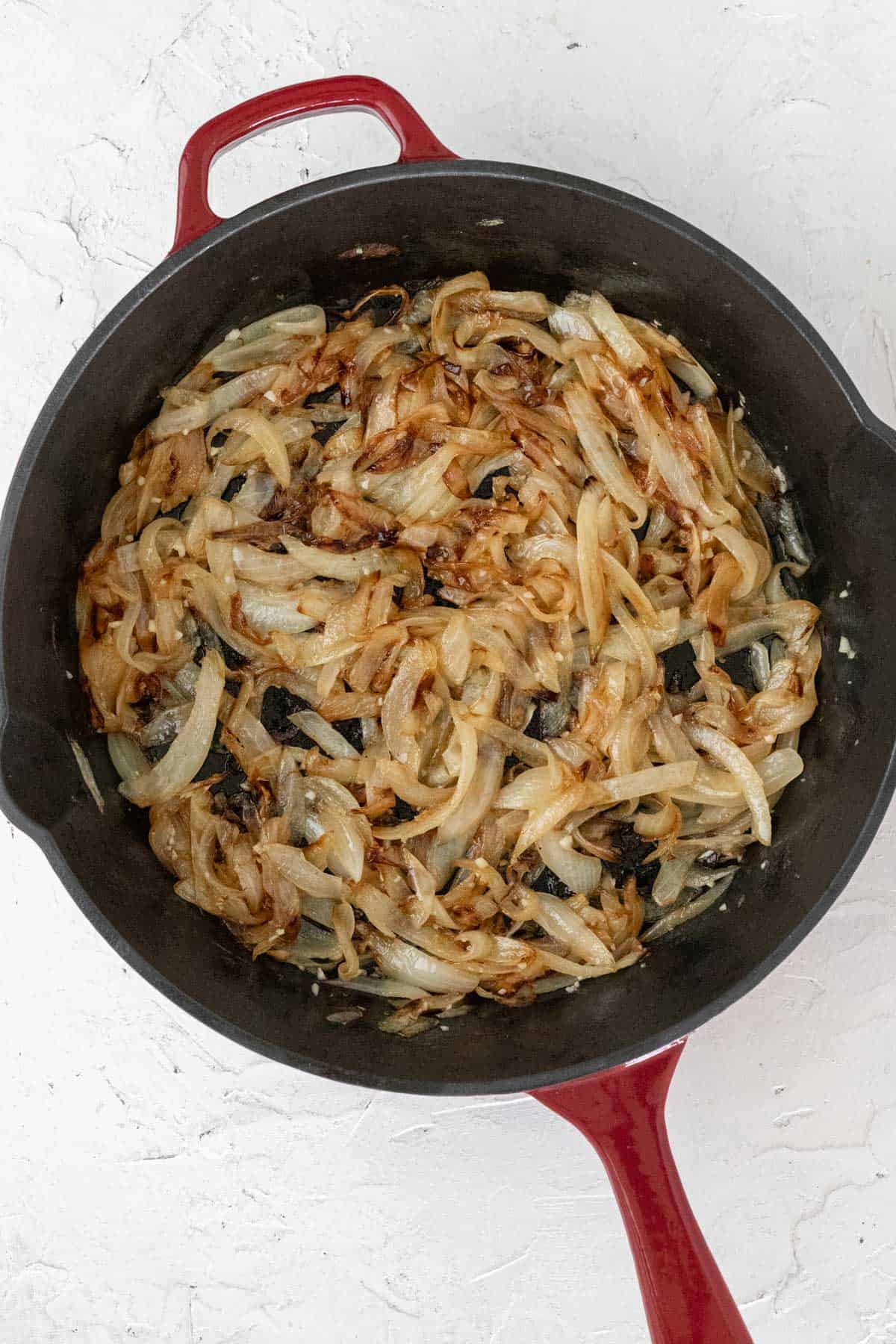 Caramelized onions in a cast iron skillet.