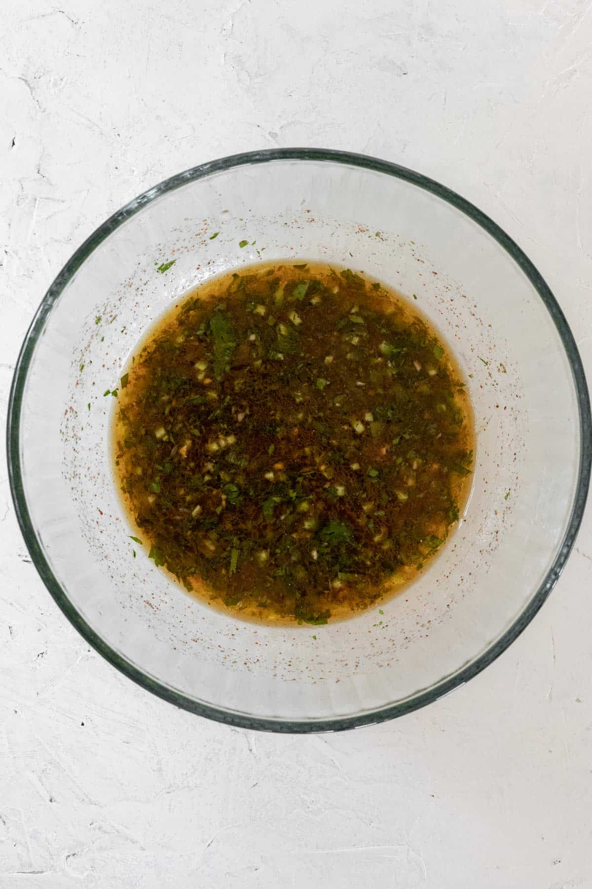 Tequila lime marinade in a glass bowl.