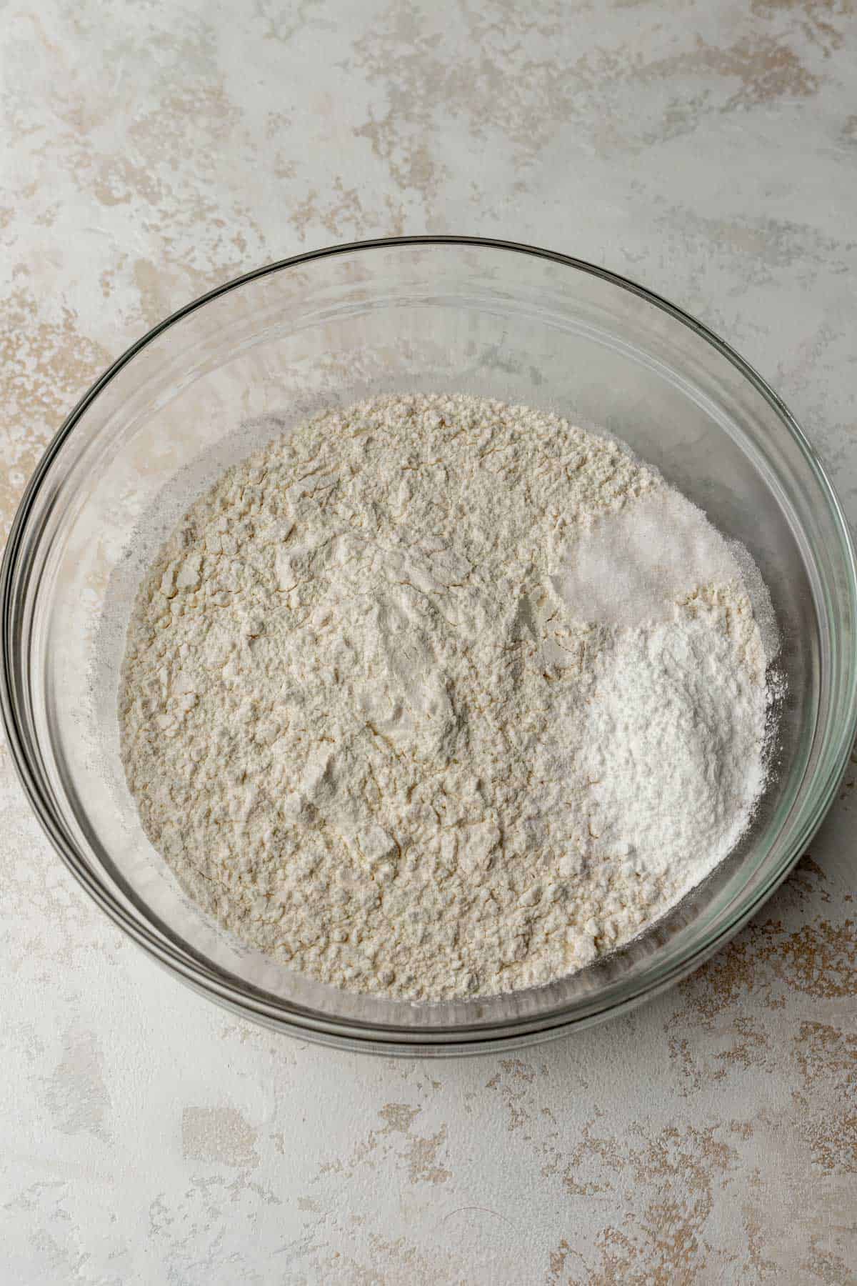 Dry ingredients in a glass mixing bowl.