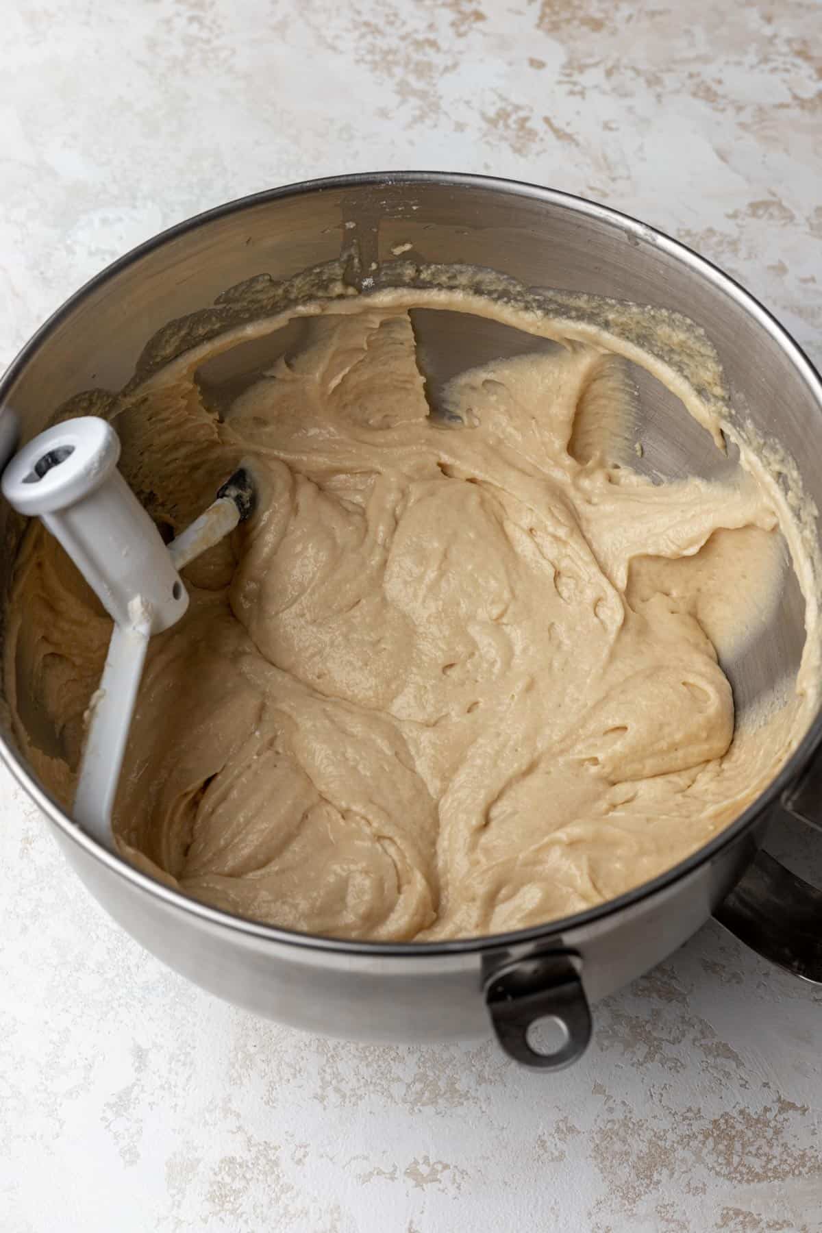 Raw cake batter in a mixing bowl.