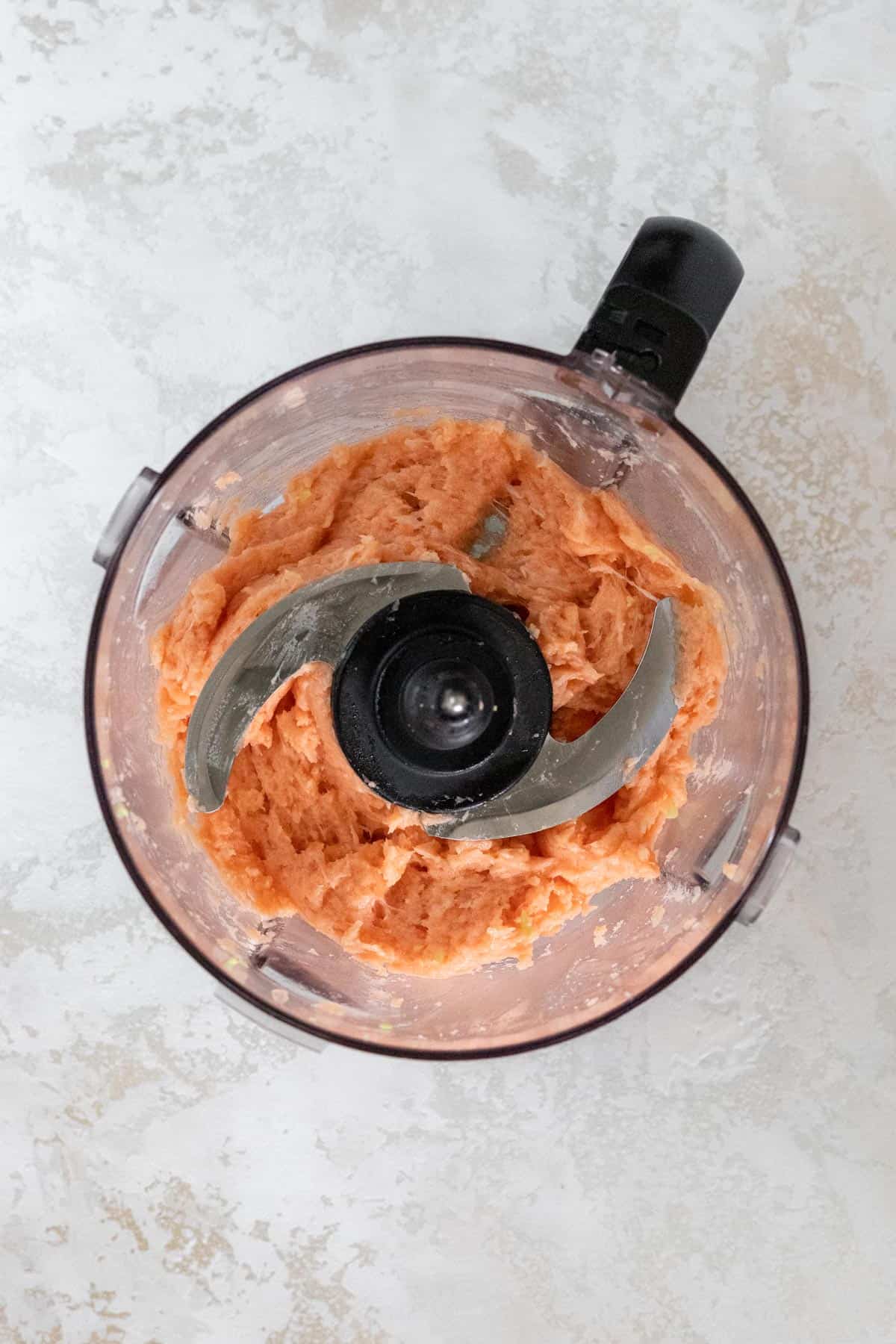 Pulsed salmon in a food processor.