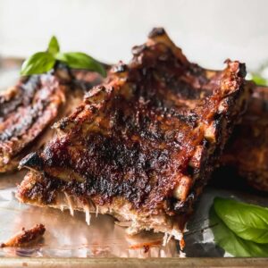 BBQ baby back ribs on a sheet pan.