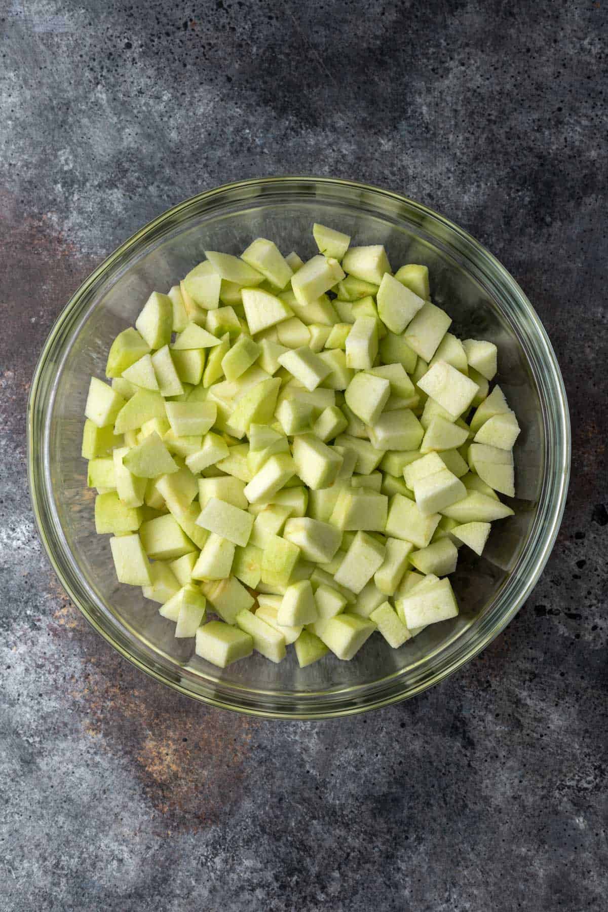 Diced apples in a large bowl.