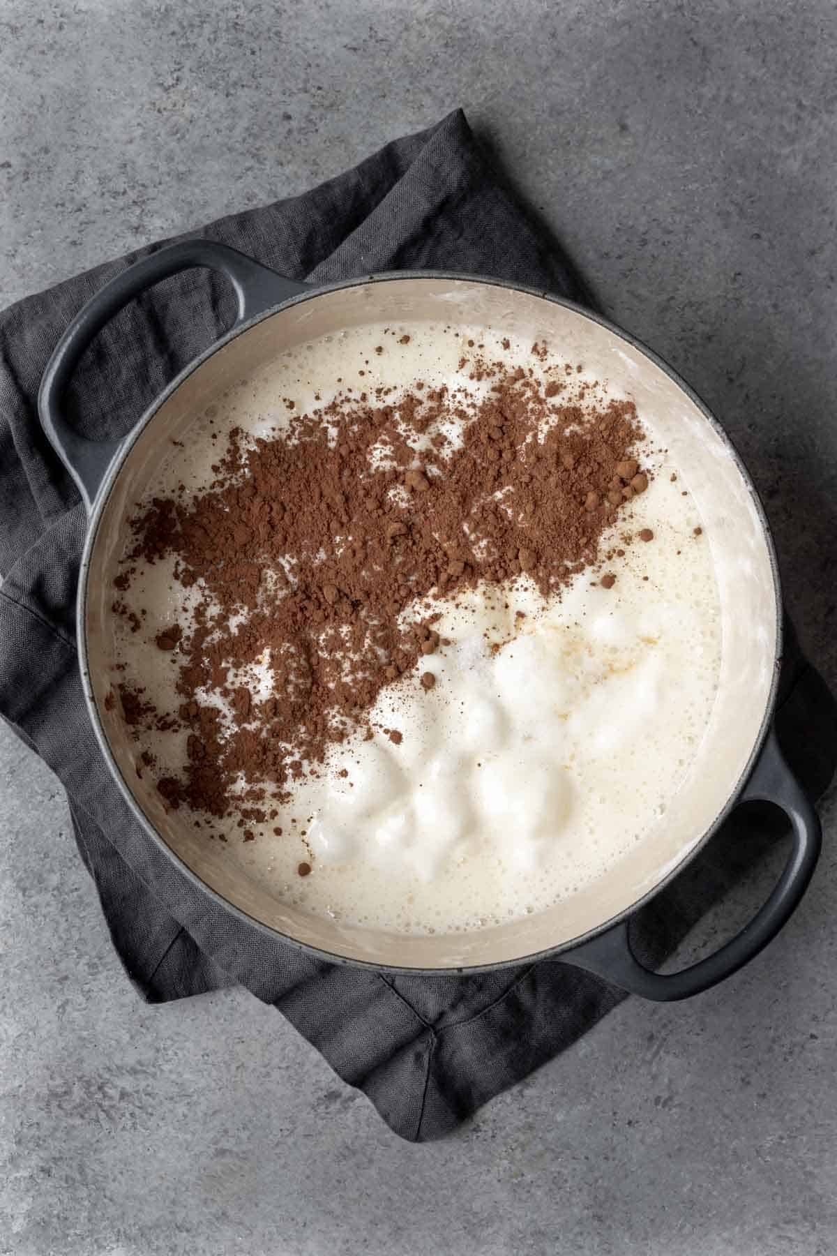 Melted marshmallows with cocoa powder in a large pot.