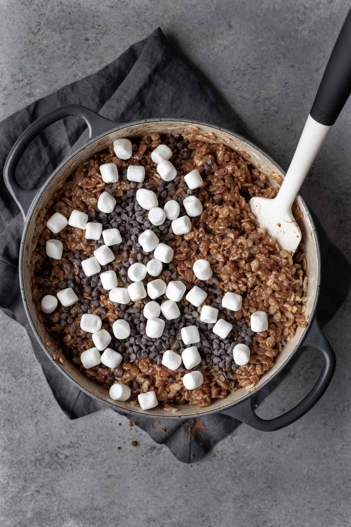 Hot chocolate rice krispies with marshmallows and mini chocolate chips stirred in.