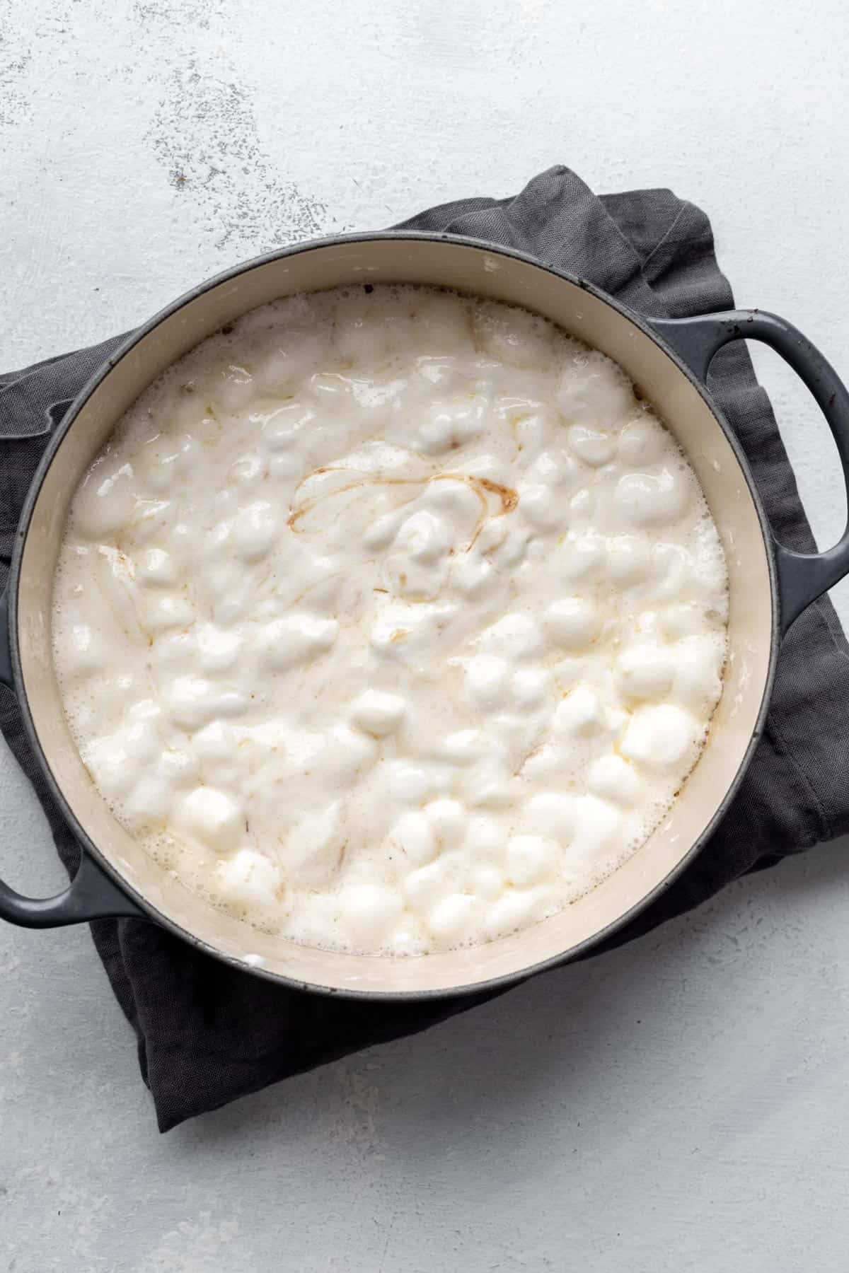 Melted marshmallows in a large pot.