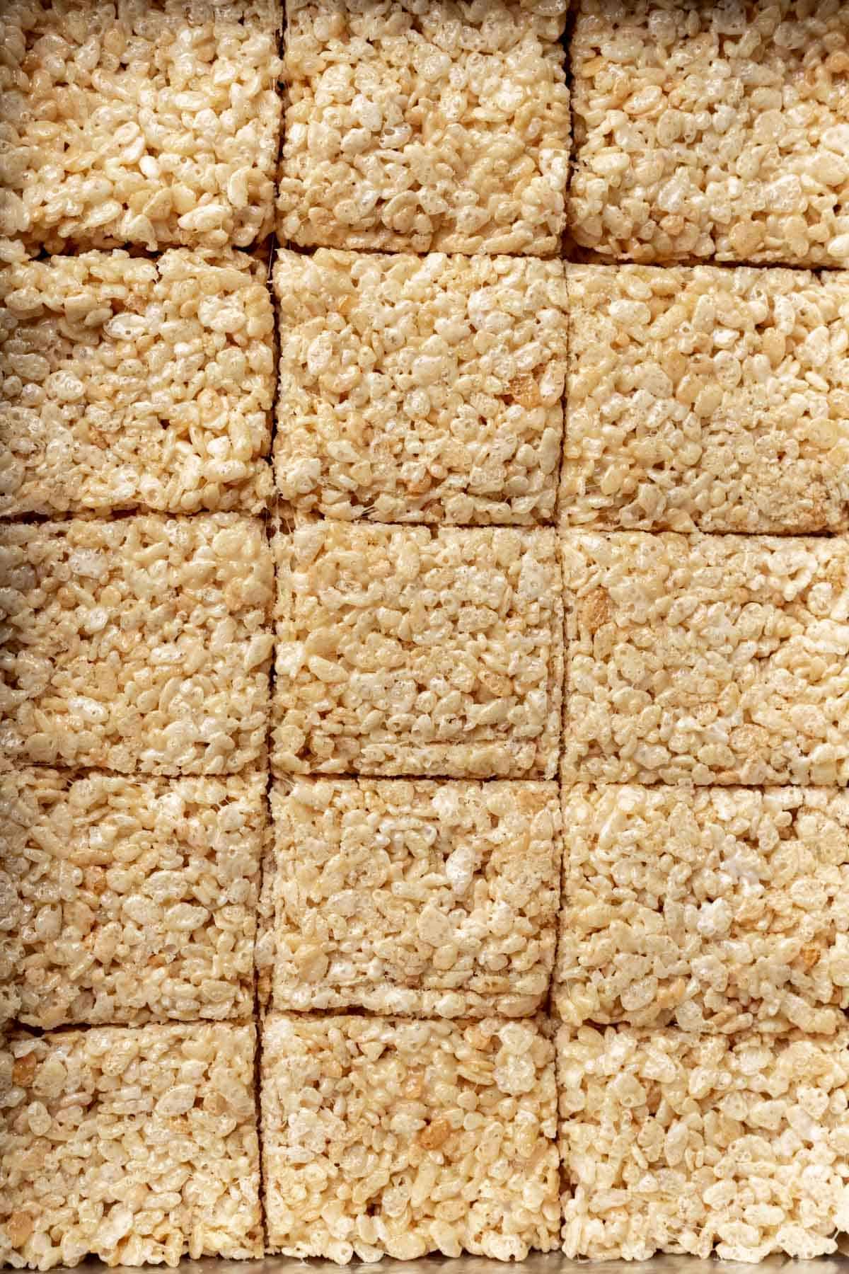 Cut rice krispie treats in a pan.