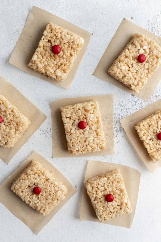 Rice krispie treats with a rudolf red nose (candy) placed in the center.