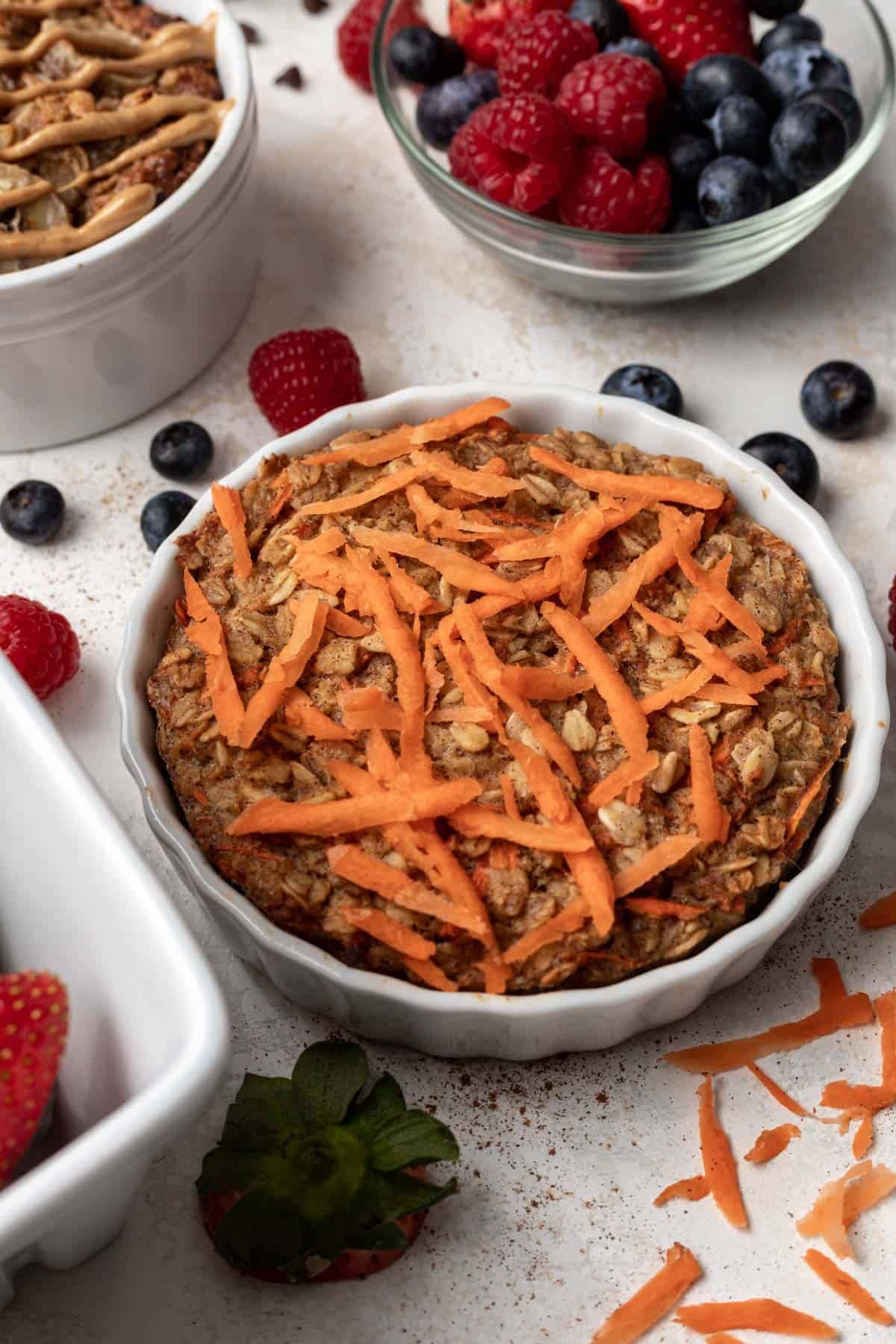 Carrot cake baked oatmeal for one in a white ramekin.