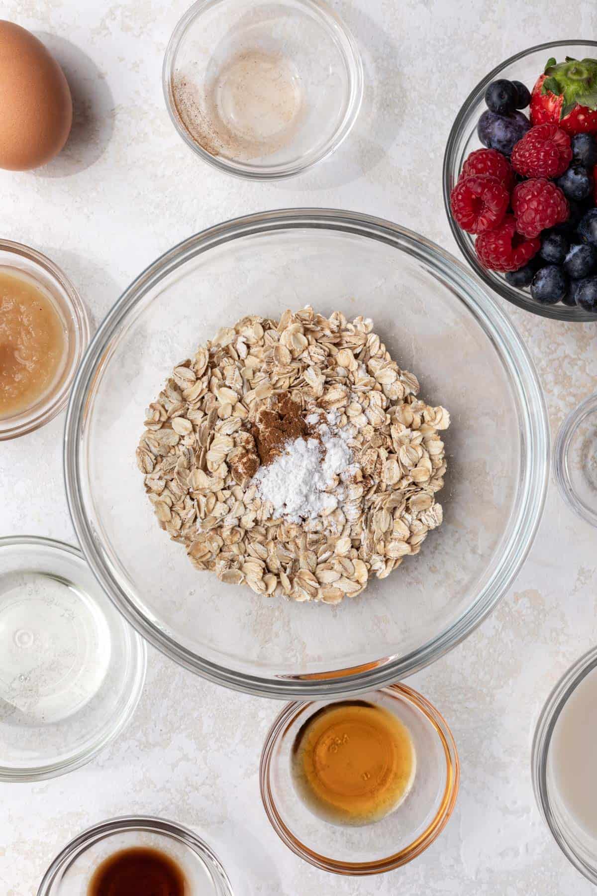 Dry ingredients for baked oatmeal in a mixing bowl.