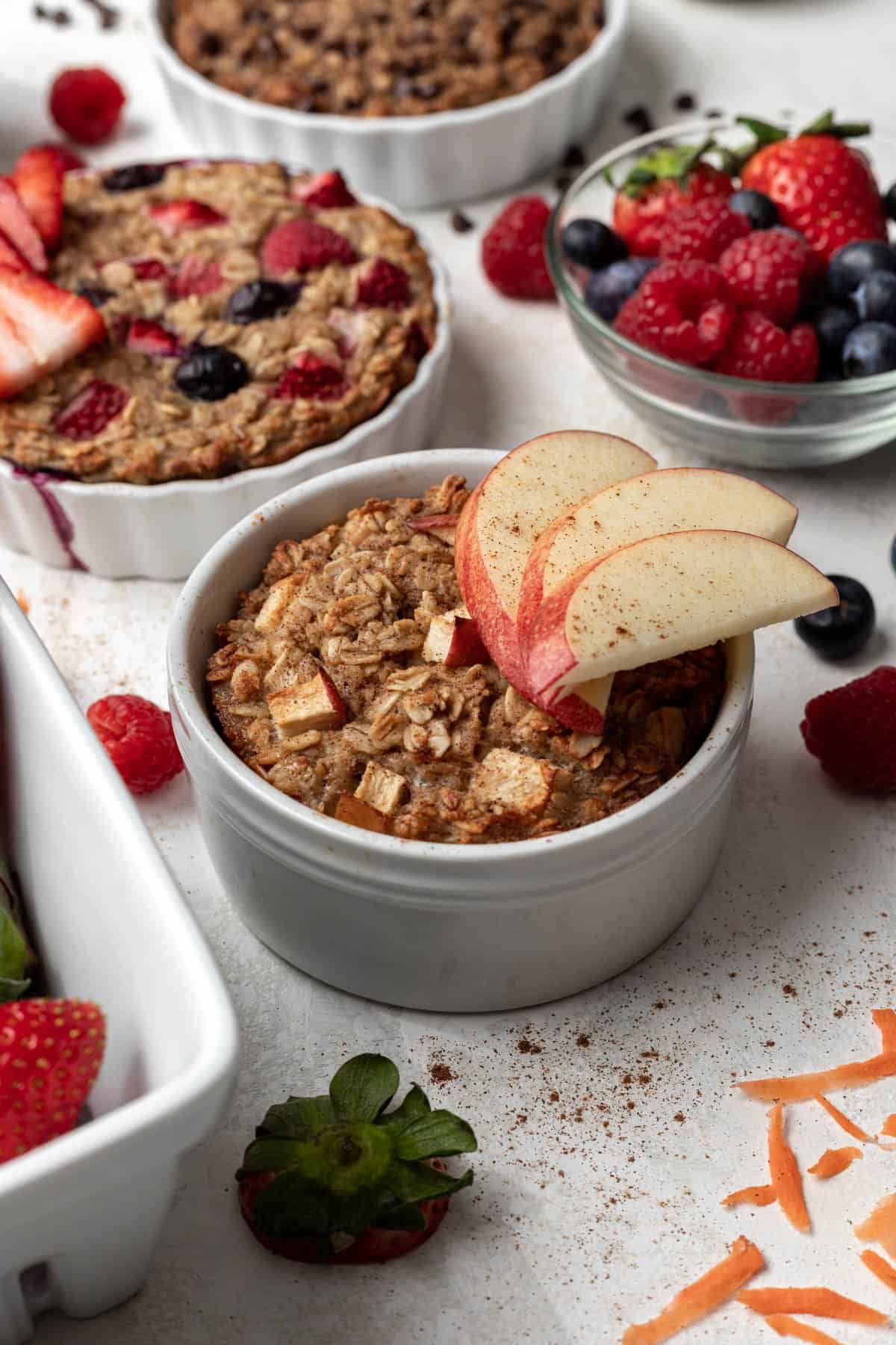 Apple cinnamon baked oats for one topped with 3 apple slices.