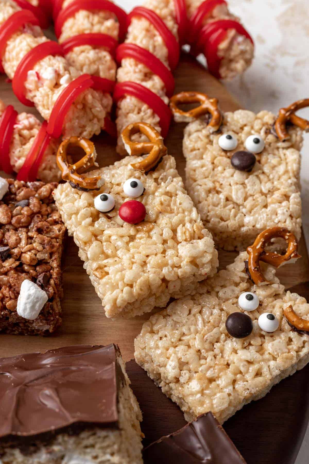 Reindeer rice krispie treats on a dessert board.