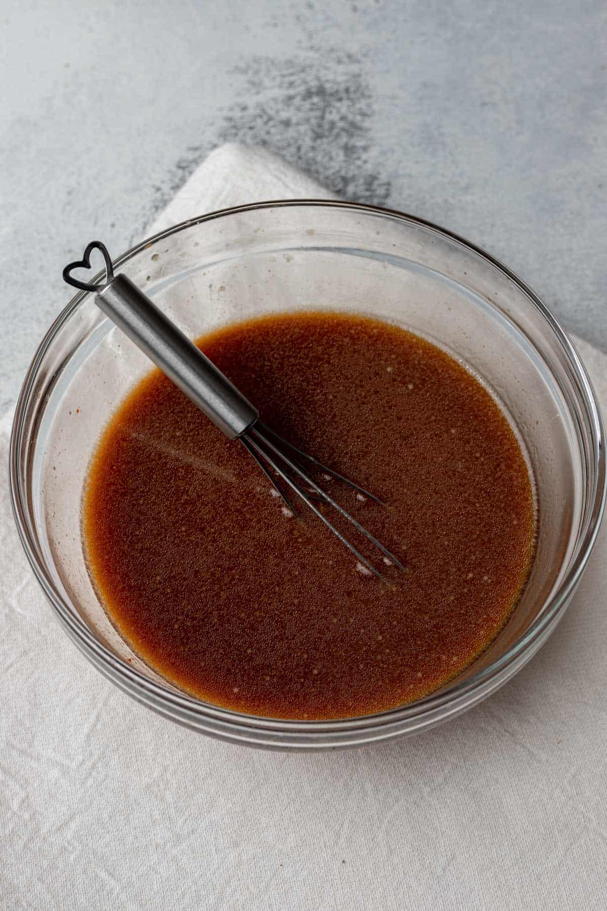Sauce ingredients whisked together in a small mixing bowl.