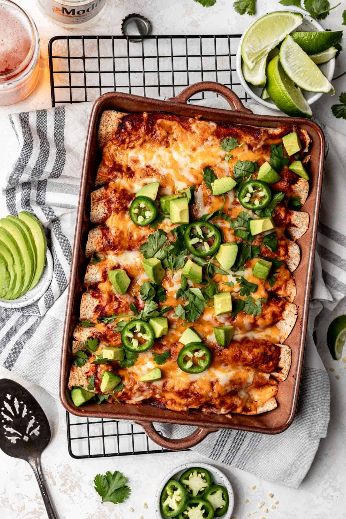 Cheesy ground turkey enchiladas topped with jalapeños, avocado, and cilantro.