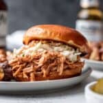 Instant pot bbq shredded chicken on a bun with coleslaw.