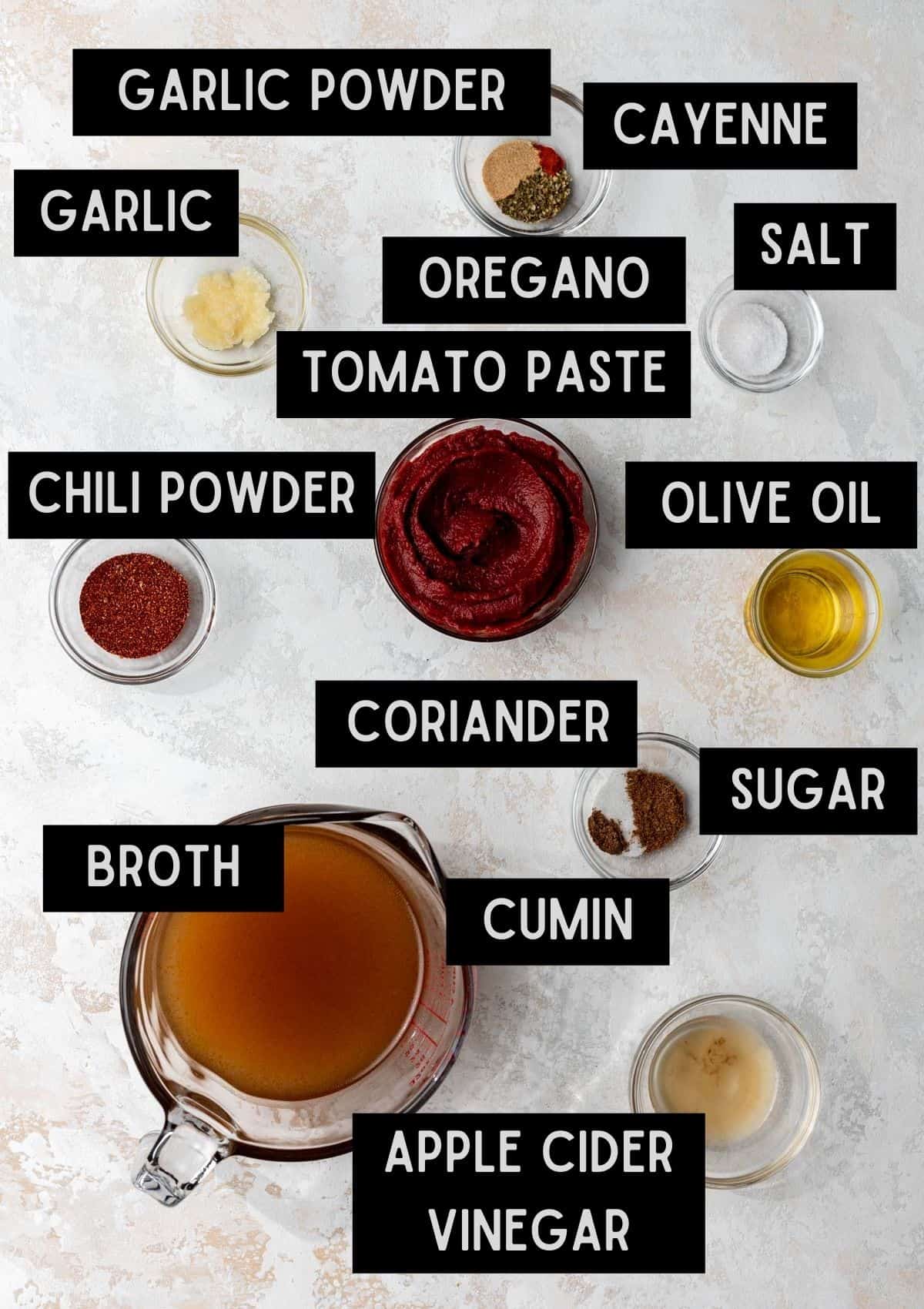 Labelled ingredients for homemade enchilada sauce (see recipe for details).