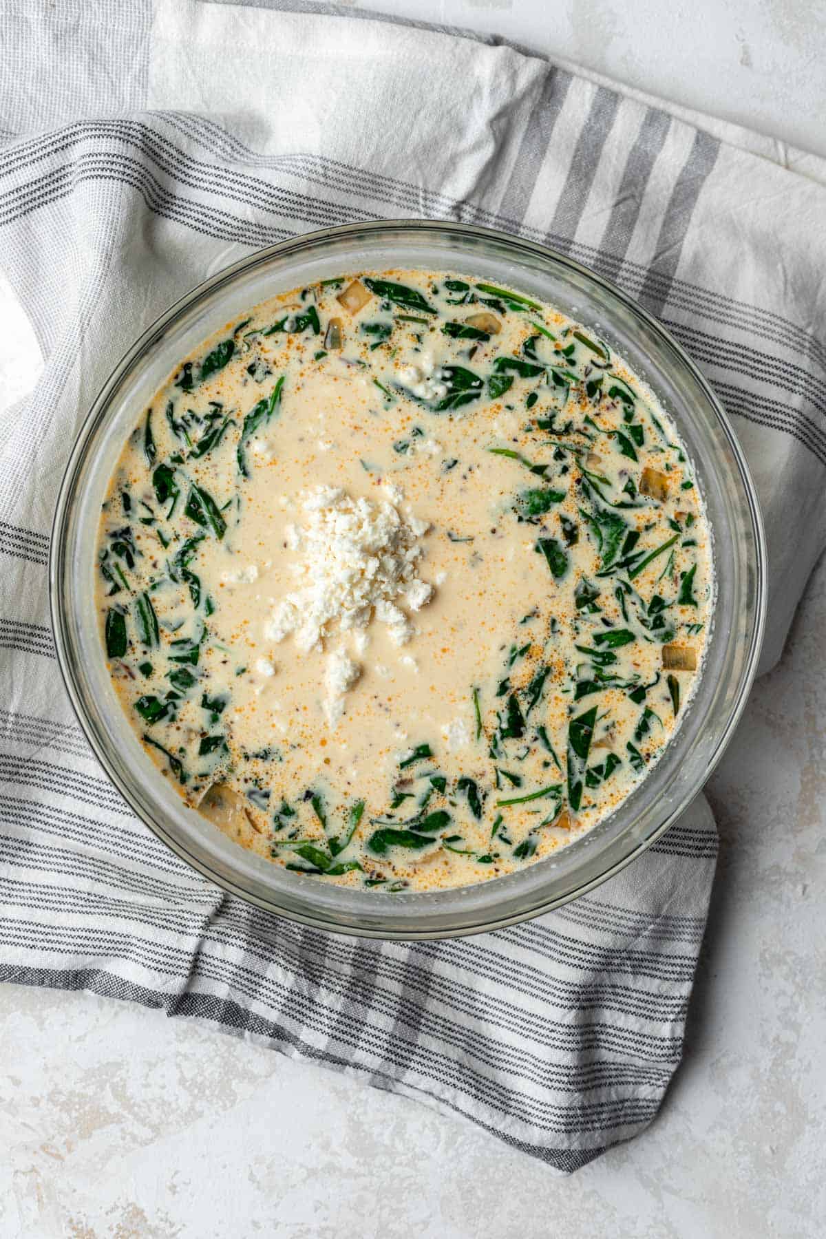 Sautéed onions, spinach, and sun-dried tomatoes mixed with the rest of the quiche filling.