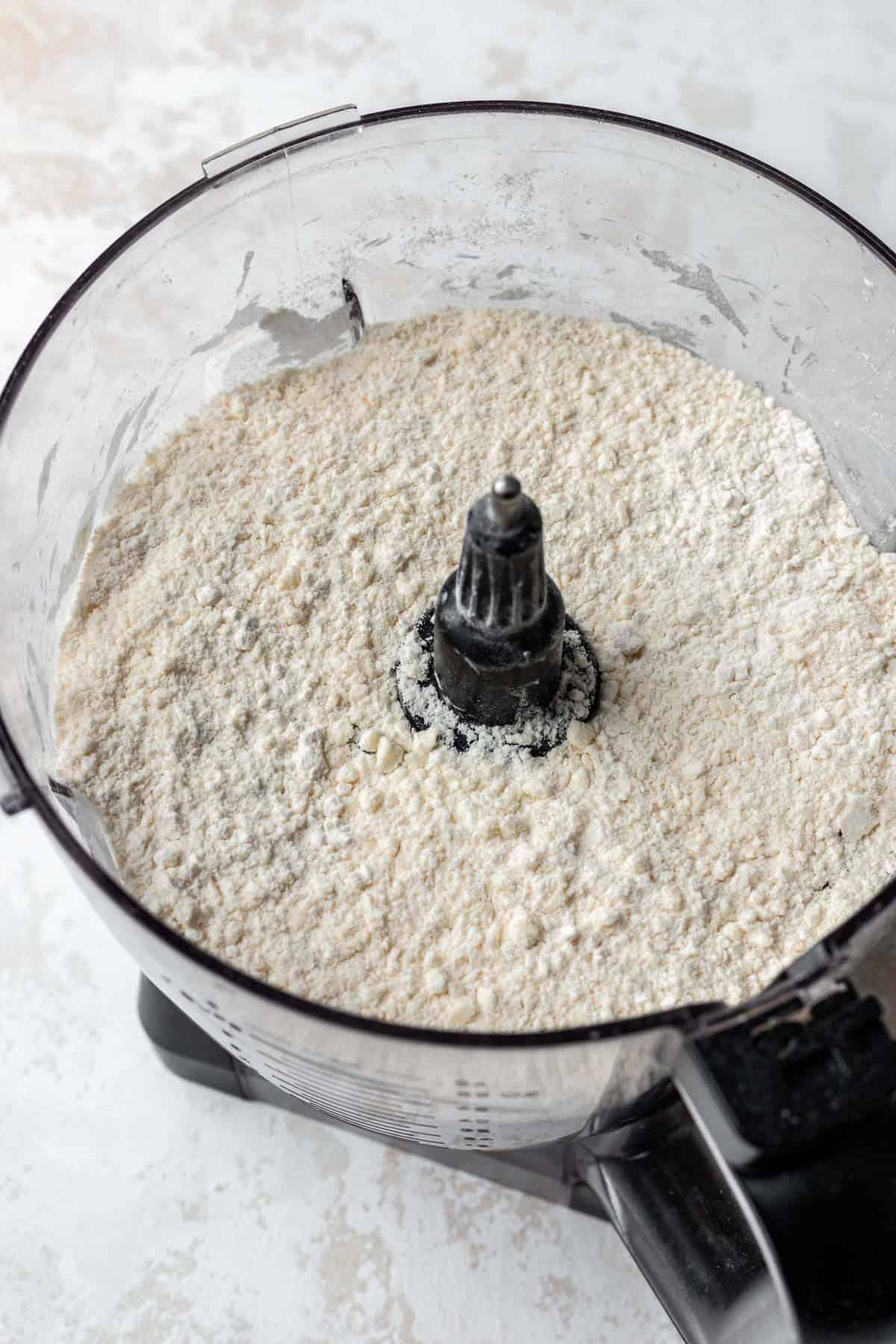 Flour, salt, and butter blended to a crumb in a food processor.