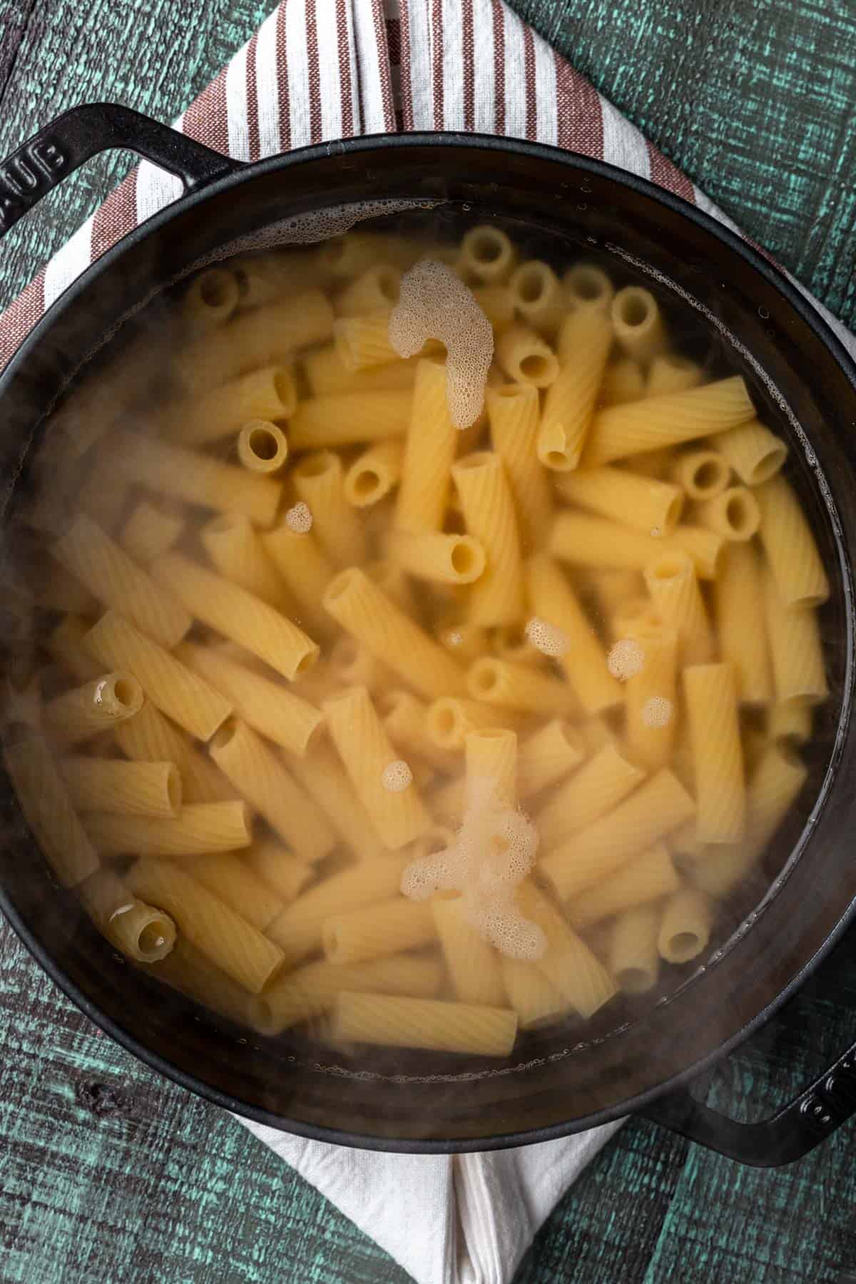 Pasta cooking in boiling salted water.