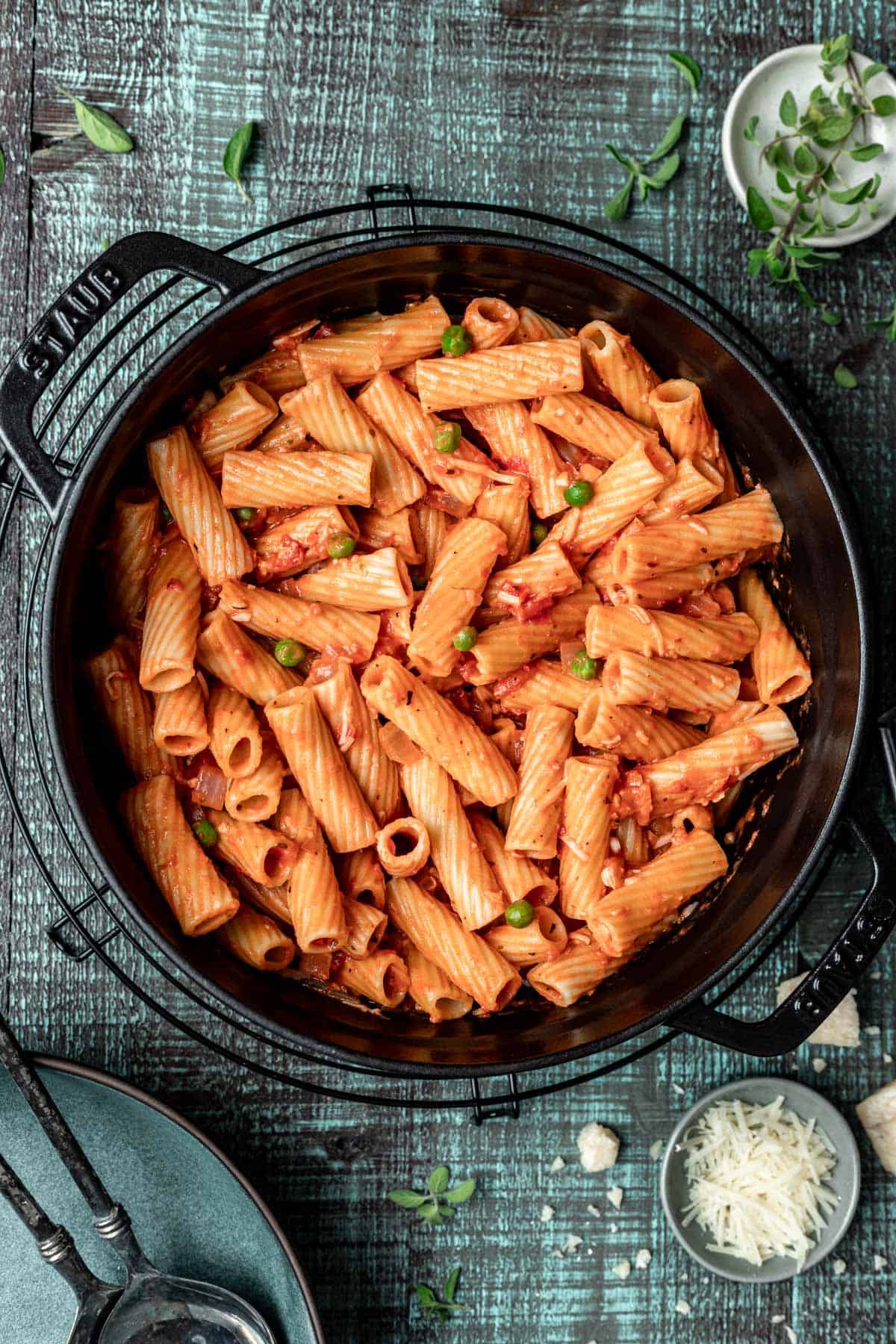 Pink sauce pasta in a large black pot.