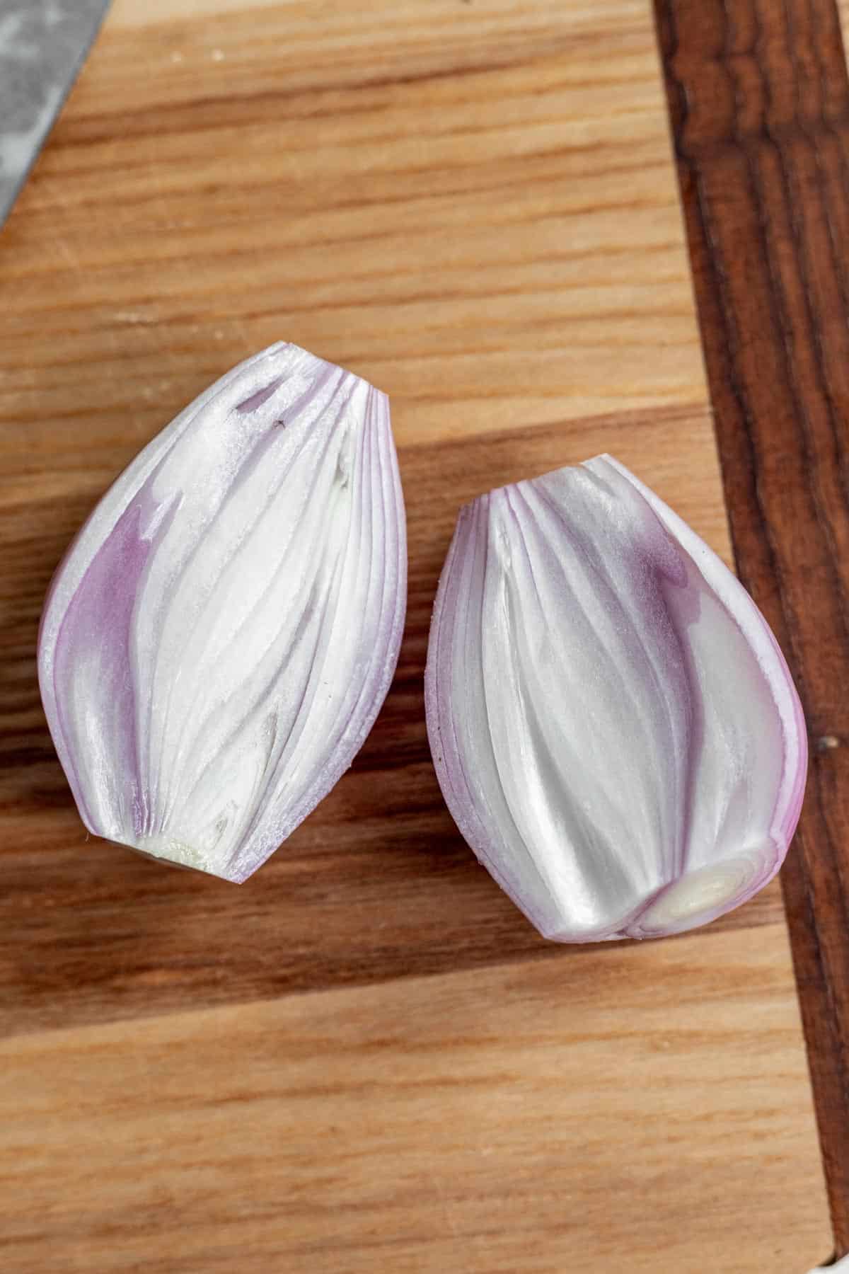 A shallot cut in half.