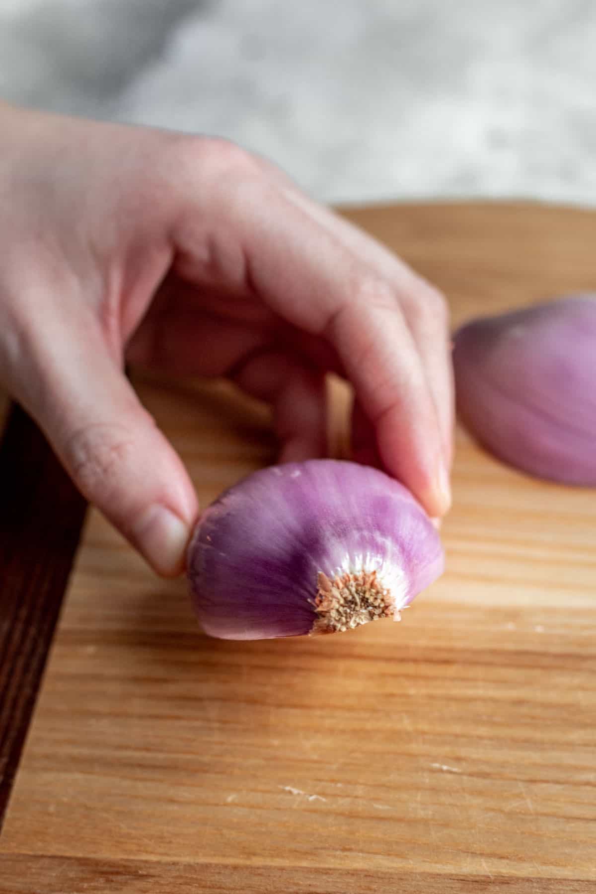 The root end of the shallot intact.