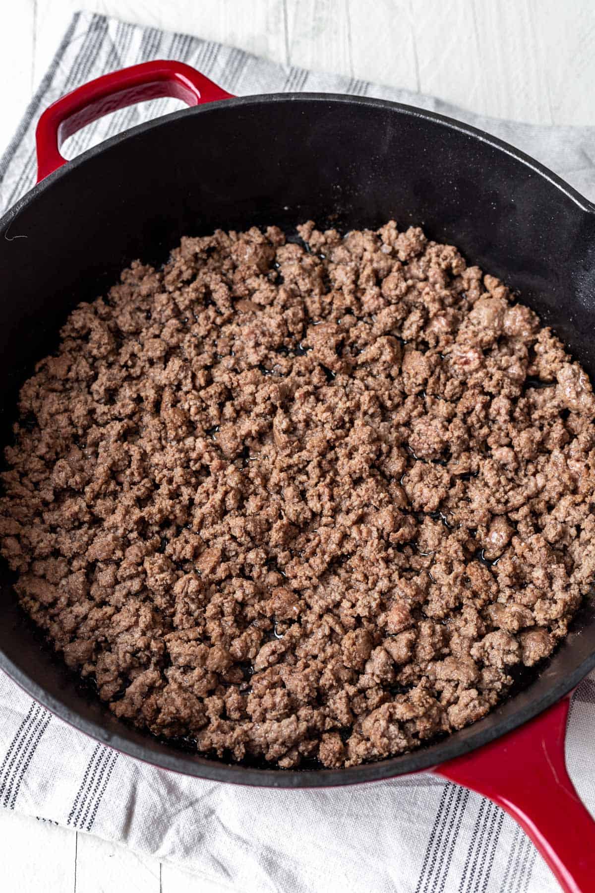 Cooked ground beef in a skillet.