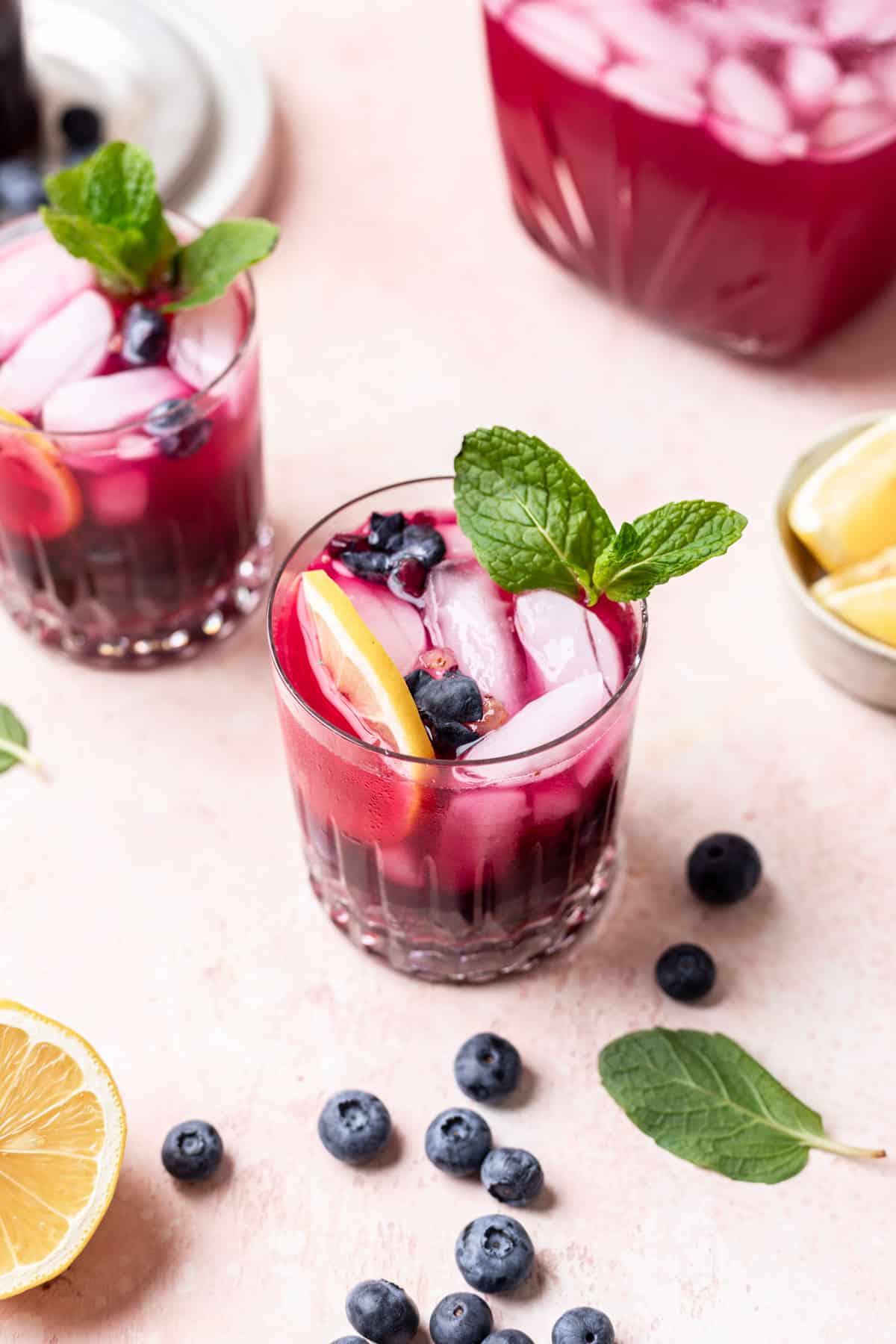 Blueberry vodka lemonade with ice, blueberries, and lemon slices.