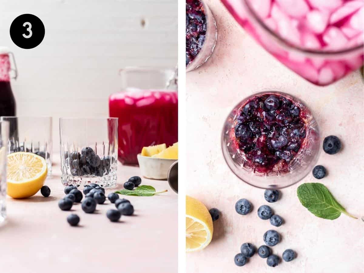 Muddled blueberries in a glass cup.