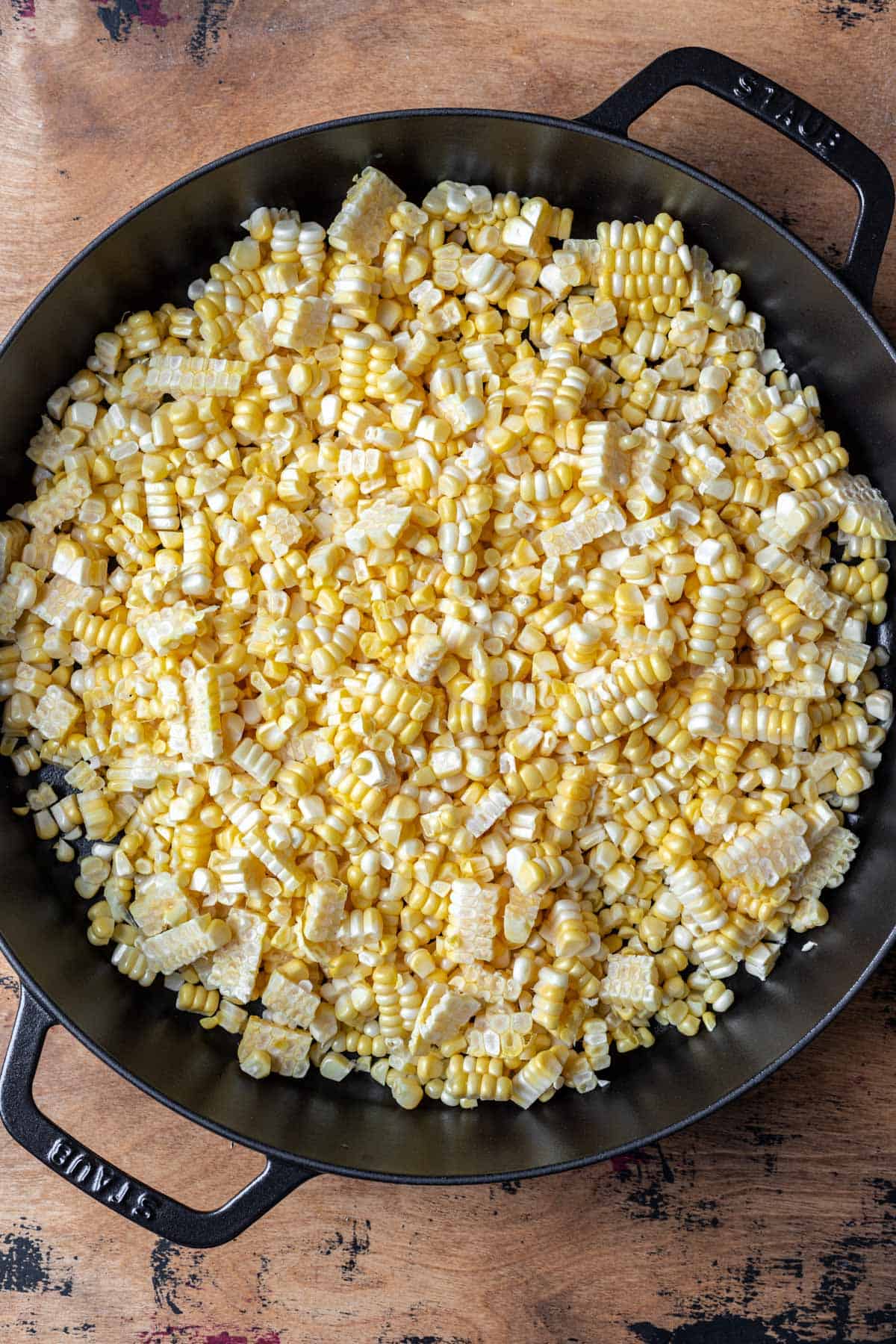 Corn kernels in a cast iron skillet.