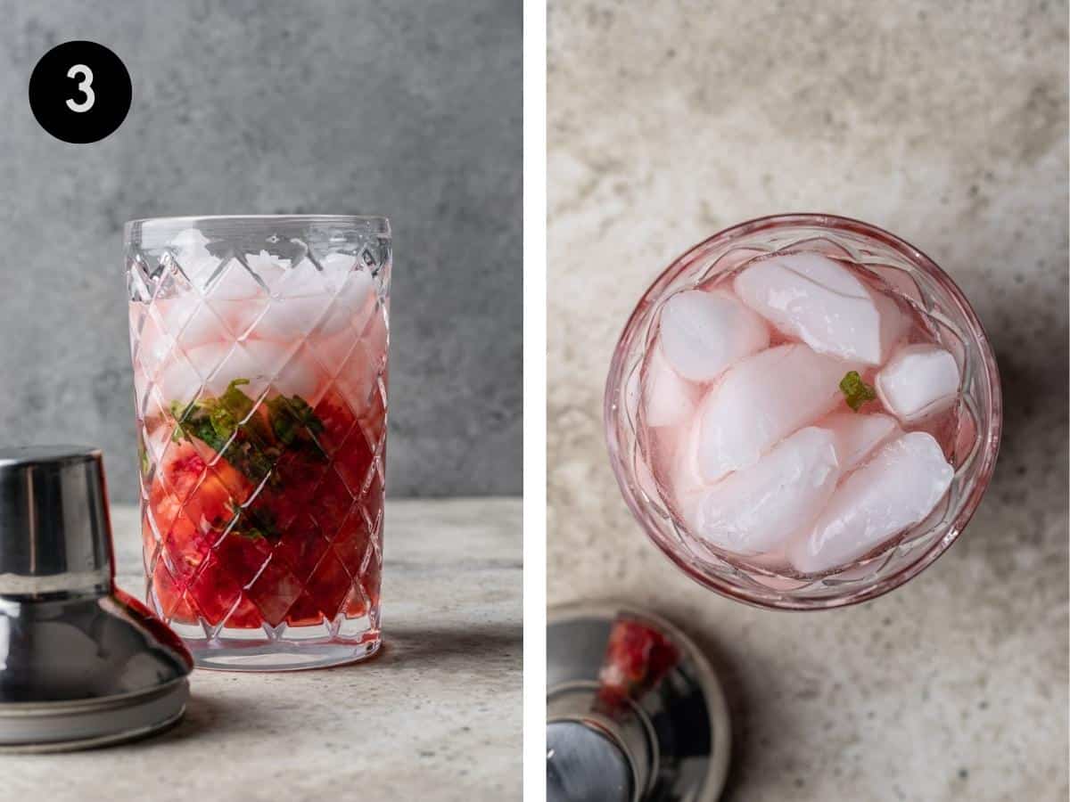Ice added to a cocktail shaker with muddled strawberries, lemon wedges, and basil.