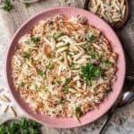 Instant pot rice pilaf in a pink serving bowl.