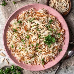 Instant pot rice pilaf in a pink serving bowl.