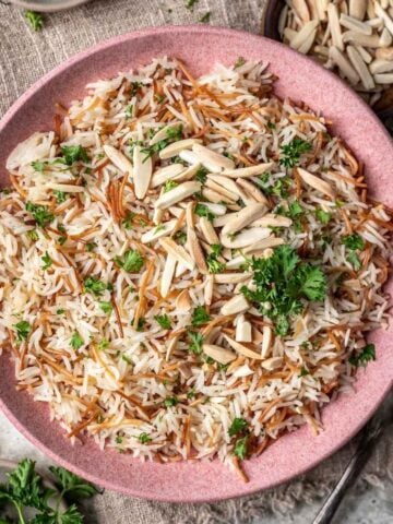 Instant pot rice pilaf in a pink serving bowl.