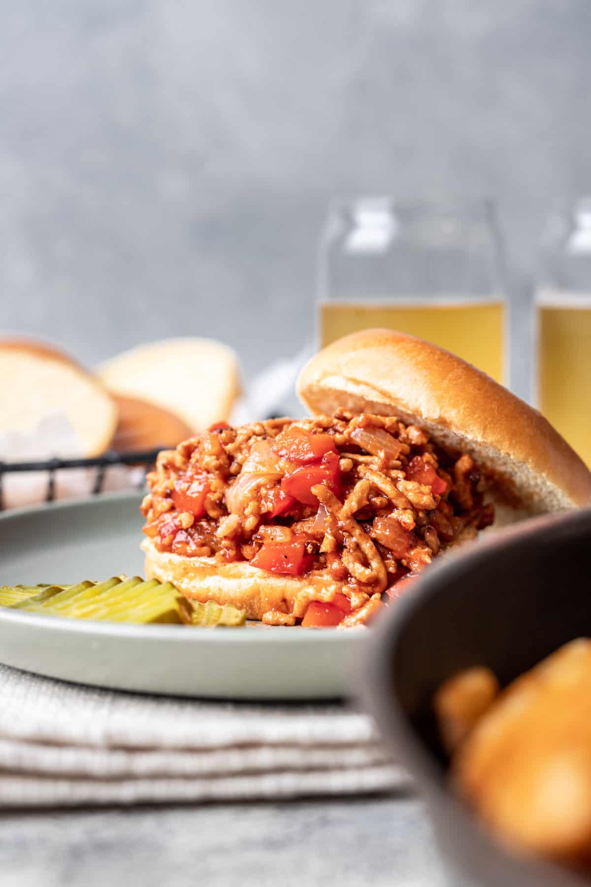 Chicken sloppy joes with two glasses of beer.